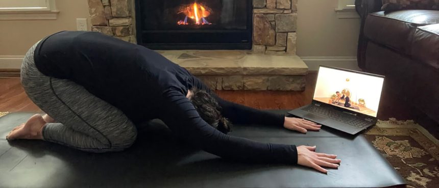 lauren studying for myvinyasa practice online teacher training at home