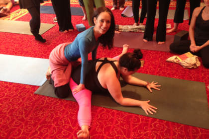 Discover the art of hands-on yoga adjustments with an experienced instructor guiding a student through a pose. Learn valuable tips for improving your practice and enhancing your technique with personalized support.