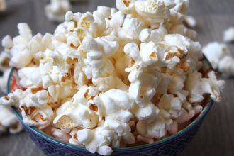 Bowl filled to the brim with popcorn